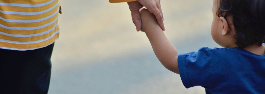 This is an image of a mother and her toddler in an article on the challenges and rewards of motherhood by Haripriya Suraj, Reiki Master